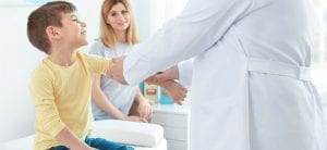 Little boy with mother at orthopedist's office